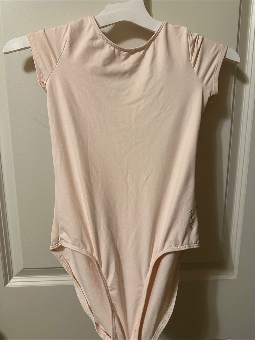 Justice Girls Short Sleeve One-Piece Bodysuit in Pale Pink